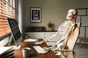 Skeleton at a computer skeleton sitting at a computer with a cup of coffee
