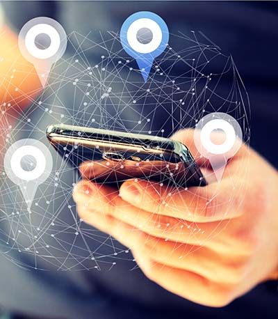 geofencing-hand Image of cell phone with location pins in a hand