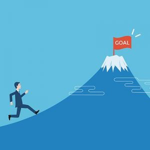 goal-complete drawing of a man running up a mountain to reach a flag on the summit reading "Goal"