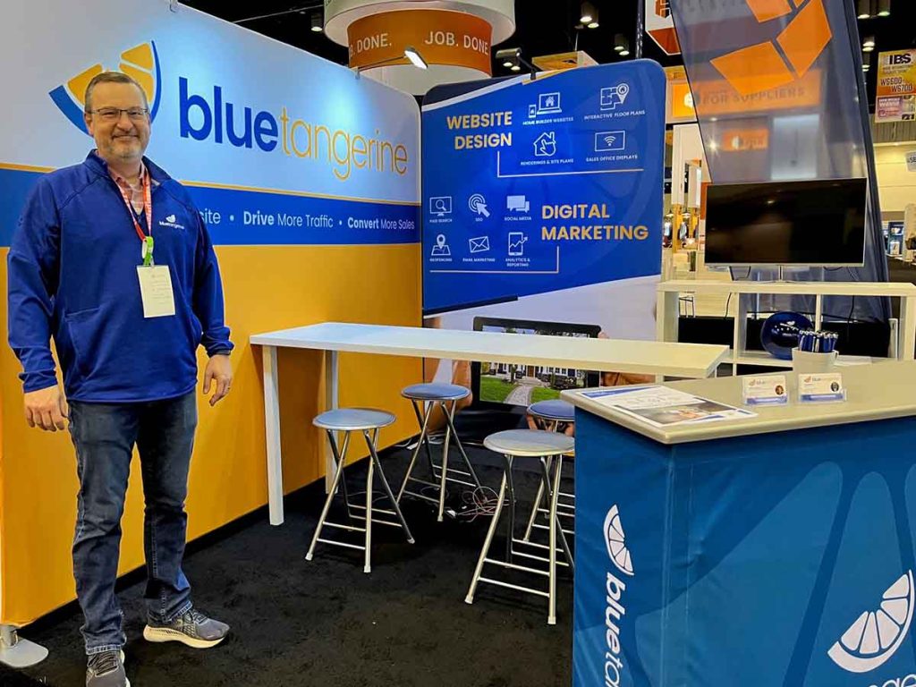 ibs-booth-with-greg greg bray blue tangerine ibs booth