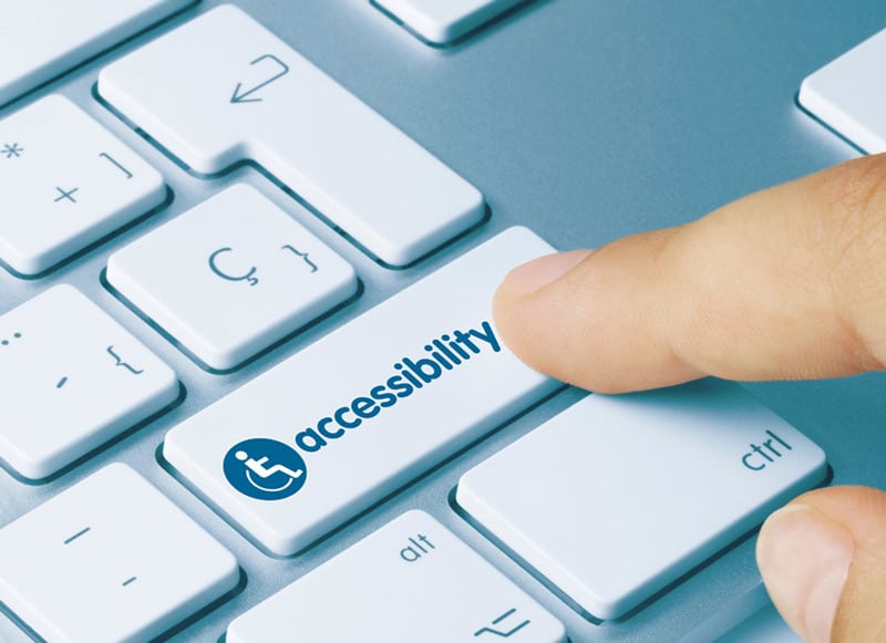 page-website-accessibility-sm-2023 Keyboard with a finger pushing a key that reads accessibility