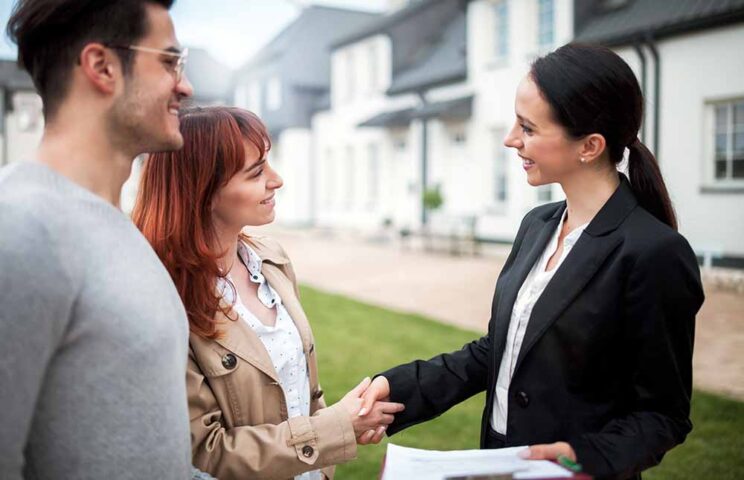 woman shaking hands with sales women shaking hands